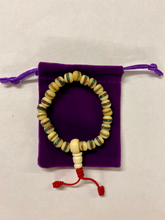 Load image into Gallery viewer, Handmade Tibetan Bone Wrist Mala Bracelet with Protective Pouch - Authentic Prayer Beads for Meditation and Mindfulness