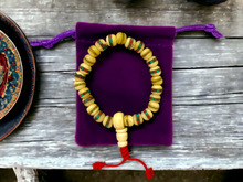 Load image into Gallery viewer, Handmade Tibetan Bone Wrist Mala Bracelet with Protective Pouch - Authentic Prayer Beads for Meditation and Mindfulness