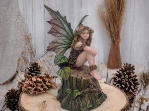 Enchanted Forest Nymph Figurine | Delicate Woodland Fairy Perched on Tree Stump | Hand-Painted Resin Fantasy Statue | Nature-Inspired Decor