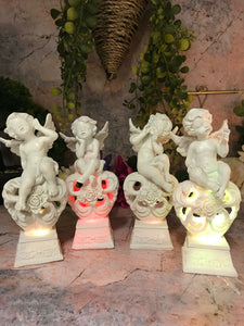 Set of Four Guardian Angel Figurine LED Cherubs Resting on Heart Sculpture Gift